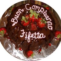 Birthday Cake This is my signature triple chocolate rum cake with strawberry and choclate glaze