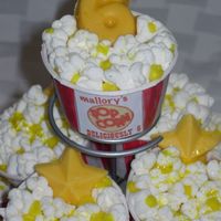 Popcorn Cupcakes Clearly these are inspired by others on this sight. I used yellow edible glitter for the "butter" and made yellow white chocolate...