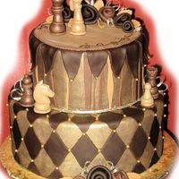 Chocolate And Gold Chess Cake sort of a mad-hatter/whimsy theme. but i didnt want to do those slanted tiers. handmade the chess figures from gumpaste.