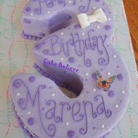 3Rd Birthday This is carved from 2 - 8 inch cakes and 2 - 9 inch cakes. Filled and then carved to achieve number 3 shape. Frosted in buttercream with...