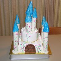 Castle Cake First castle cake I've ever made. I think it turned out okay.. hehe. White cake with buttercream frosting. Fondant covered wrapping...
