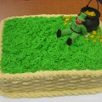 Leprechaun With His Pot Of Gold Chocolate cake covered w/buttercream. Leprechaun is gumpaste. Pot is just a plastic thing I picked up at the party store. I wish I'd...