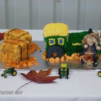 Tractor Grooms Cake For Doug Chocolate cake with buttercream icing and two hay stacks also with buttercream icing