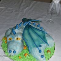 Dragon Grooms Cake This was my brothers grooms cake. It is iced and decorated in diabetic buttercream icing and the wings, eyes, nose and spine are fondant.