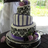 Courtney Had fun doing this cake I had to purchase the whole stencil kit just for one stencil design. The bride loved her cake.