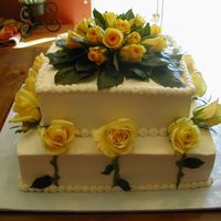 Yellow Rose Buttercream Wedding Cake Cake in all buttercream frosting with fresh yellow roses.