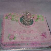 Baby Shower Cake Baby shower cake with mirror and silver baby buggy. Cake is half chocolate, half white.
