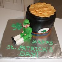 St. Patrick's Day Pot O' Gold Pot O' Gold cake with Leprechaun figure. Cake is french vanilla with a black cherry filling, made from half the sports ball pan and a...