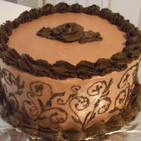 "4 Times The Chocolate" Cake Quadruple chocolate cake - swiss chocolate and white chocolate swirl cake, with dark chocolate fudge filling and milk chocolate buttercream...