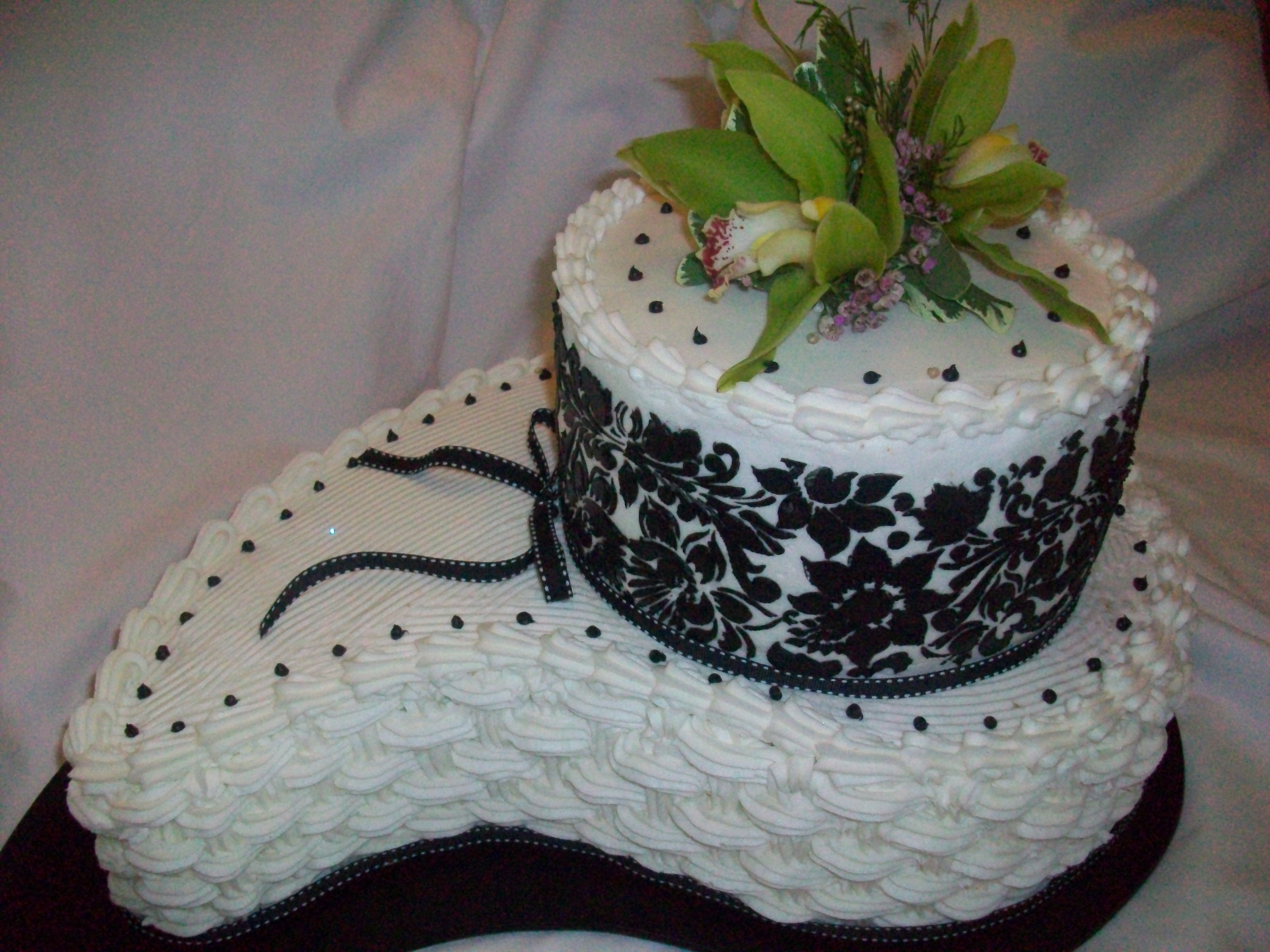Black & White Cake I created this out of buttercream at the bride to be's request. This was for a bridal shower. I used a comma pan and a round cake for...