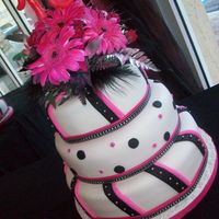 Pink Black & Silver This is just a simple fondant cake with a color scheme of Pink, Black and Silver for a 16th birthday girl.