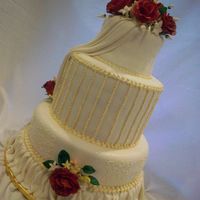 Sanchezcake.jpg This is a wedding cake I made recently. The flowers are all handmade with gumpaste; the cake is vanilla and the filling is cheesecake and...