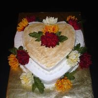 Heart Shaped Bridal Shower Cake This was made for my cousin's bridal shower for an autumn wedding. White cakes with buttercream icing and gold dust. flowers are silk...