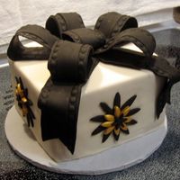 Wedding Cake Sample - Black & Gold This was a sample cake I created for a bride whose colors for her wedding are black and gold. The cake is a white cake with BC filling,...