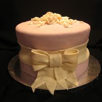 Lavendar And Ivory Tied Birthday Cake This cake was inspired by a cake I saw on CC by jsmith and loved the design. This cake was made using two 9" layers and one 8"...