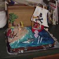 Pirates Buried Treasure This was my first "real" theme cake. It was for my son's birthday. It's had a shipwrecked pirate on the island and the...