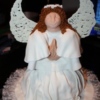 Angel Cake yellow cake with buttercream covered in marshmallow fondant. Wings are royal icing.
