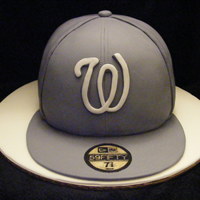 Baseball Cap This was made for a special young man turning 30. Covered in fondant w/ Fondant accents. Edible image for sticker