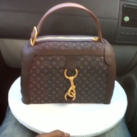Louis Vutton Purse This was a cake made for my husbands Boss for her birthday. She had no clue that she was getting a cake not alone a purse cake. she was...