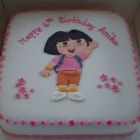 Dora The Explorer The cake is a 10 inch chocolate madeira covered in chocolate butter cream and then fondant. Dora and all the decorations are fondant with...