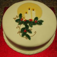Christmas Candlelight This is an idea from a book called Making Beautiful Christmas Cakes. It is a fruit cake covered in mazipan and fondant. The candle plaque...
