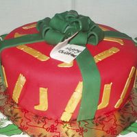 Christmas Present This is an early cake for a Nursery (Kindergarten) Christmas fair. It is an 8 inch madeira cake covered in bc and then fondant. The ribbon...