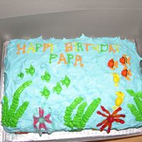 Ocean/fish Theme Cake This is a buttercream cake with fish made out of M&M's.