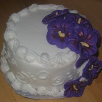 Tropical Wedding Test Cake This is a test cake for a bride who wanted a tropical theme. The flowers are fondant. The bride wanted purple hibiscus and she liked the...