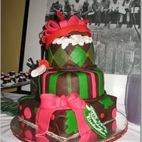 Christmas Graduation And Birthday Cake Three tier cake, covered in modeling chocolate. Fondant decorations including removable lid. The cake has a diploma for her graduation, a...