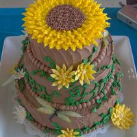 Sunflower Birthday Cake Peanut butter pound cake w/chocolate buttercream frosting. fondant flowers and ricepaper/buttercream dragonflies. this was my first time...