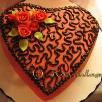 Weddingday Cake This was just a test cake. Cake is covered with a marzipan and piped with free hand using chocolate. Roses I made from a marzipan also. I...