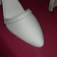 First Shoe Close Up I used a metal stencil that I placed on top of the gumpaste and rolled it. I should have pressed a little harder to get more even...