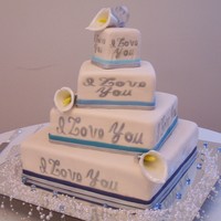 Calla Lilly Off Center Square 4 tier off center square (16, 12, 8, 4) with airbrushed phrases and gumpaste Calla Lillies.