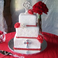 Square Wedding Cake 3 Tier Square wedding cake with gumpaste roses, fondant pearls and cross to match Groom's Tattoo.