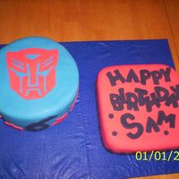 Transformers Cake I was going to stack the round cake on top of the square cake but my daughter ate part of the bottom layer while it wass cooling so had a...