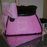 Juicy Couture Purse Cake Pound Cake w/ Strawberry Filling. Covered w/ Fondant.