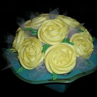 Yellow Rose Cupcake Bouquet This is my very first cupcake bouquet!!! It came together just how I had hoped! I love it when that happens!!! I had to keep telling people...