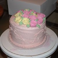 Pink And Yellow Roses This was just a practice cake I did for my mom and sister to see. It was a champagne cake with champagne icing. The roses are royal icing...