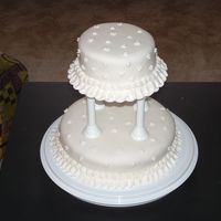 Final Wilton Cake This was my final cake for my Wilton class. I hadn't quite gotten my roses down yet, so I just did a Mickey Mouse inspired pattern.