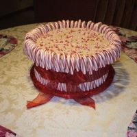 Candy Cane Cake 10in chocolate cake filled and iced in a chocolate bettercreme. Topped with peppermint baking bits and surrounded by candy canes. Canes...