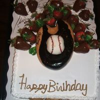 Baseball_Glove_Cake.jpg Got this idea from someone on here! Thanks! It was vanilla cake with strawberry filling in the middle. My husband made the glove and the...