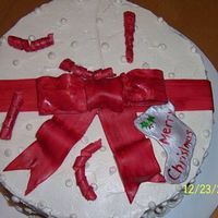 Holiday Cake Red velvet cake w/ fluffy white frosting. I wasn't too happy w/ how the bow turned out but it tasted awesome. My first time using...
