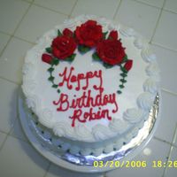 S4010307.jpg Just a simple birthday cake. Buttercream roses. Love the Americolor Super Red; makes life so much easier.