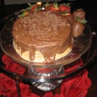 Simply Chocolate Chocolate cake iced with butter cream chocolate icing w/ melted chocolate icing poured over it to give it that extra crunch before you get...