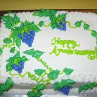 Grapevine THIS WAS AN ANNIVERSARY CAKE FOR SOME FRIENDS. WHITE CAKE W/ BUTTERCREAM ICING. THEY WERE HAVING AN ITALIAN DINNER SO I THOUGHT OF GRAPES...