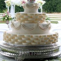 Drapes And Baskets This is one of my first wedding cakes. It is a dummy cake. My mom handed this one over to me because she got to busy. Thanks mom.(...