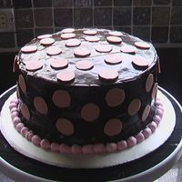 Birthday Cake Choc cake, choc ganache, choc polka dots and BC border. First time working with ganache, what a pain!