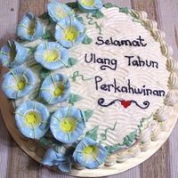 Anniversary this is a chocolate moist cake decorated in buttercream. wanted to usechoc topping, but it just would'nt set well. ended up scraping...