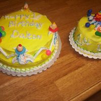 1St Birthday 2 cakes for a 1st birthday. . . one for everyone and one for destruction. It was yellow w/buttercream.