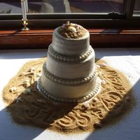 Dscf4113.jpg First wedding cake, done for niece's beach themed wedding. Thanks to all who posted pictures, that I used as examples. White chocolate...